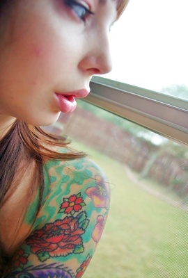 Ivy Snow showing her new colorful tattoos