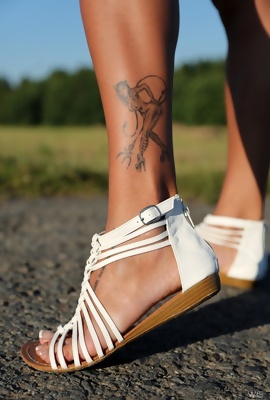 Sexy tattooes on her leg and her belly